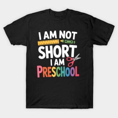 Black t-shirt with colorful "I Am Not Short, I Am Preschool" slogan, featuring school-themed graphics.