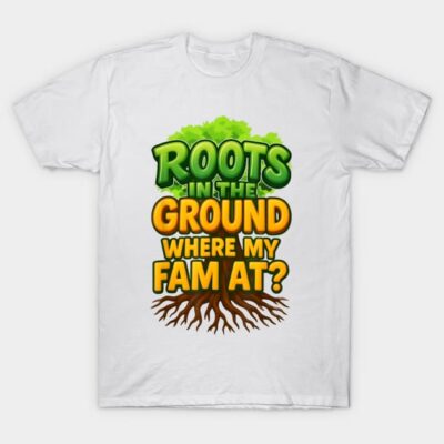 White t-shirt with colorful text design "Roots in the Ground Where My Fam At?" featuring a tree and roots graphic.