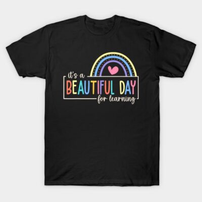 Black t-shirt with colorful "Beautiful Day for Learning" text and rainbow graphic, casual cotton style.