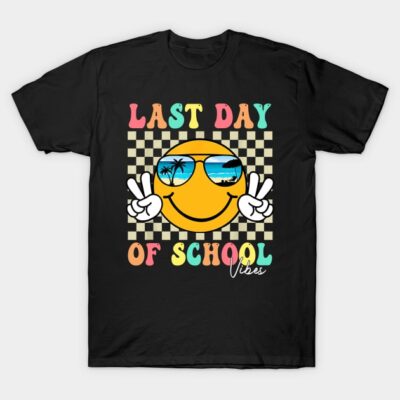 Black t-shirt with "Last Day of School" graphic, featuring a smiling emoji with sunglasses, perfect for casual wear.
