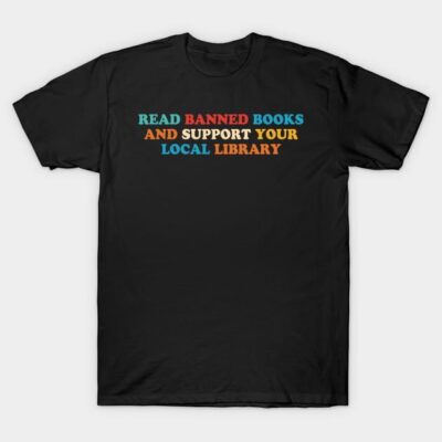 Black t-shirt with colorful text promoting reading banned books and supporting local libraries, casual style.