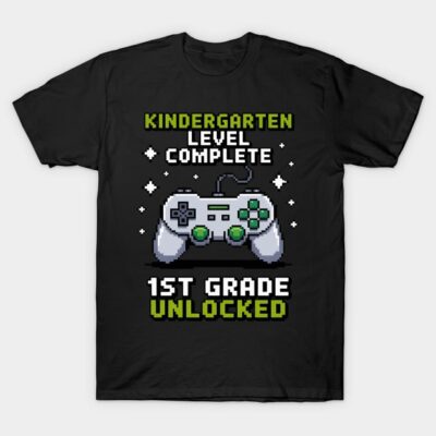 Black t-shirt with video game controller graphic, text "Kindergarten Level Complete, 1st Grade Unlocked," fun style.