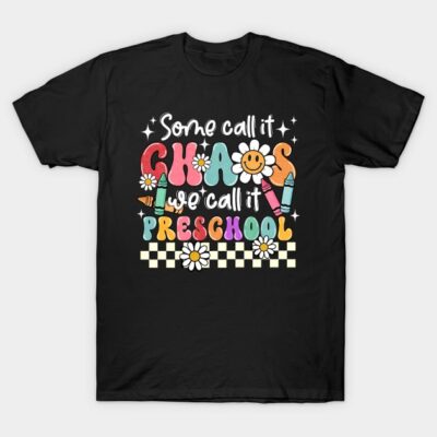 Black t-shirt with colorful preschool-themed graphic, featuring crayons, daisies, and playful text design.