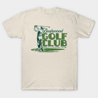 Cream t-shirt with green "Bushwood Golf Club" graphic, casual style, ideal for golf enthusiasts.
