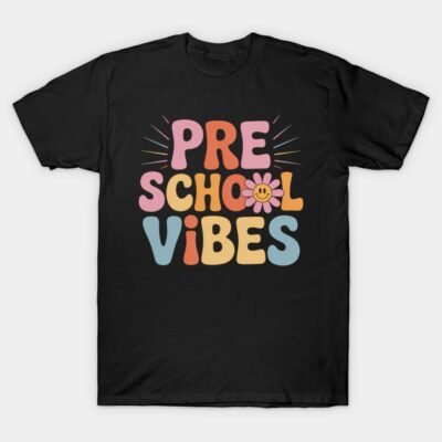 Black "Preschool Vibes" t-shirt with colorful retro lettering and flower graphic, ideal for casual wear.