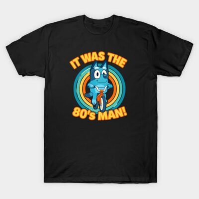 Black t-shirt with retro graphic design, featuring a blue cartoon character riding a bicycle and text "It Was the 80's Man!"