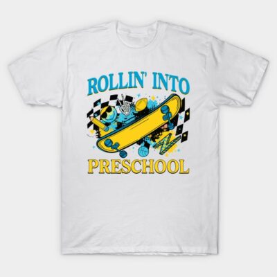 White t-shirt with colorful "Rollin' Into Preschool" design featuring skateboard and playful school-themed graphics.