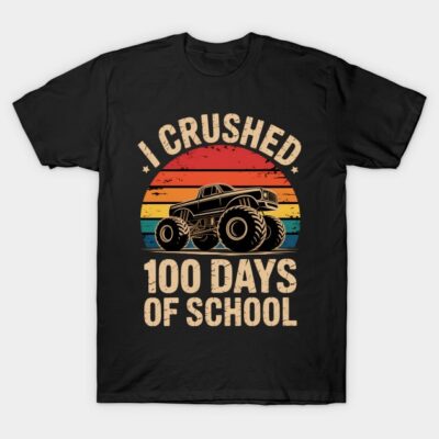 Black t-shirt with colorful retro monster truck design and "I Crushed 100 Days of School" text, perfect for celebrations.