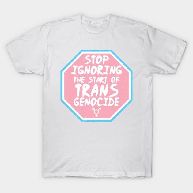 White T-shirt with pink octagon and blue trim featuring a bold message advocating for trans rights.