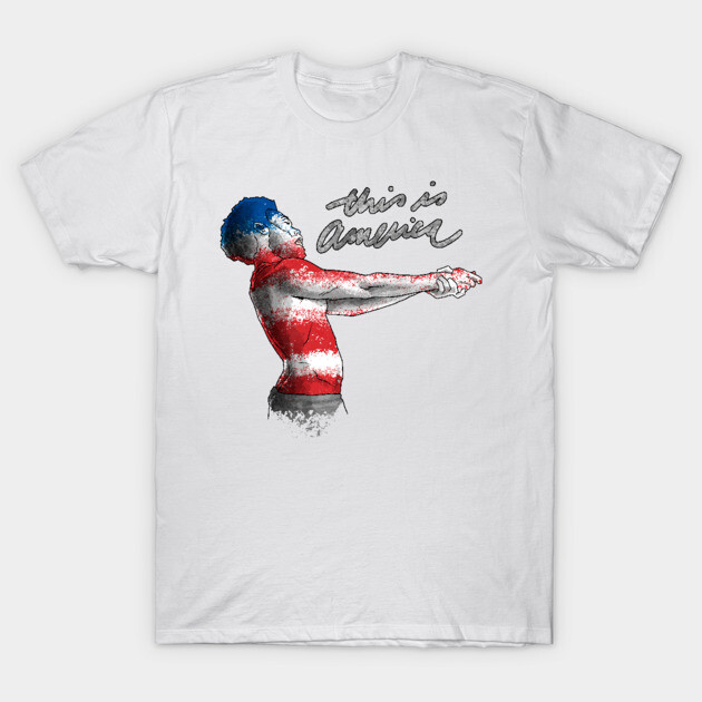 White t-shirt with artistic American flag design, featuring "This is America" text. Casual wear, cotton material.
