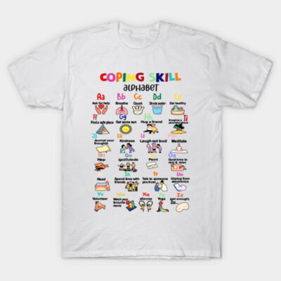 White t-shirt with colorful "Coping Skill Alphabet" design, featuring letters and illustrations for stress relief activities.