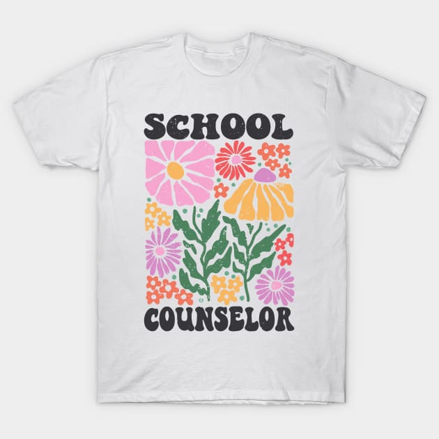 White t-shirt with colorful floral design and "School Counselor" text, perfect for educators, 100% cotton.