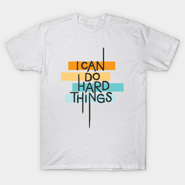 White motivational T-shirt with colorful "I Can Do Hard Things" text design, casual cotton wear for everyday inspiration.
