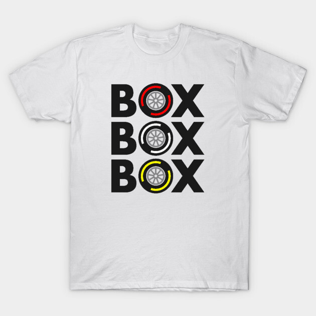 White t-shirt with "Box Box Box" text and tire design in red, white, yellow. Casual wear, cotton material.