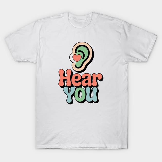 White t-shirt with colorful "Hear You" design, featuring ear graphic. Casual style, suitable for everyday wear.
