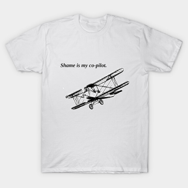 White cotton t-shirt with vintage airplane graphic and "Shame is my co-pilot" text, casual wear.