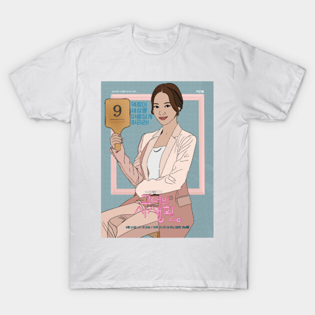 White t-shirt with pastel illustrated design, featuring a woman holding a paddle. Casual style, cotton material.