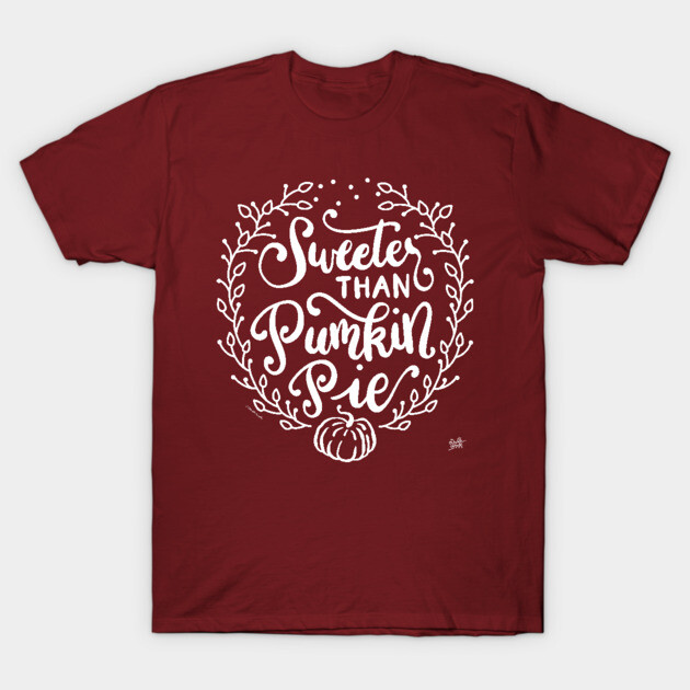 Maroon t-shirt with "Sweeter Than Pumpkin Pie" white text and decorative design, casual fall fashion, cotton material.