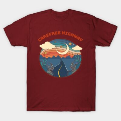 Maroon t-shirt featuring "Carefree Highway" design with a colorful scenic road and night sky graphic.