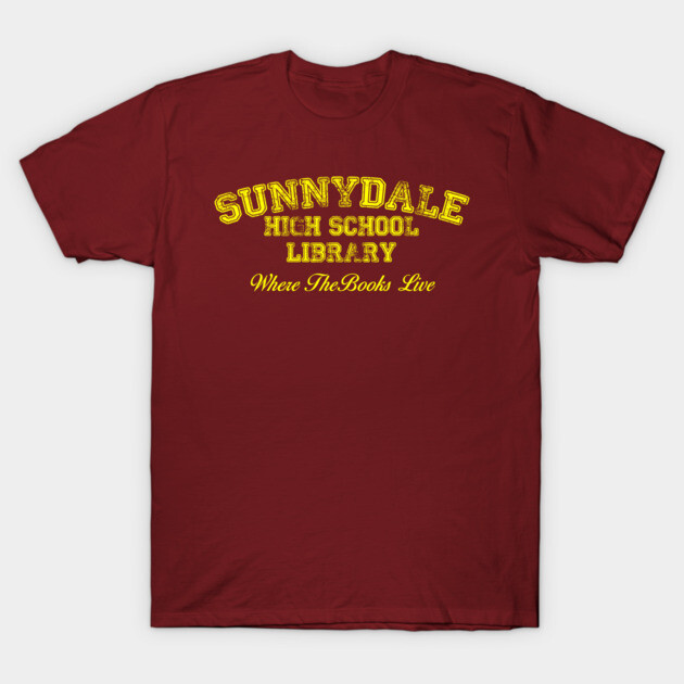 Maroon t-shirt with yellow "Sunnydale High School Library" text, casual style, cotton material, perfect for daily wear.