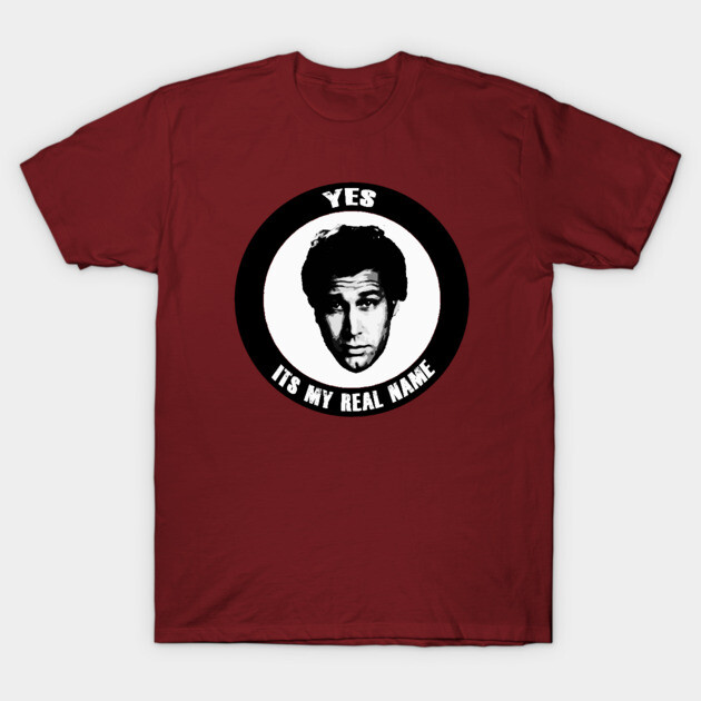 Burgundy t-shirt with black and white graphic design, featuring text "Yes, It's My Real Name", casual wear.
