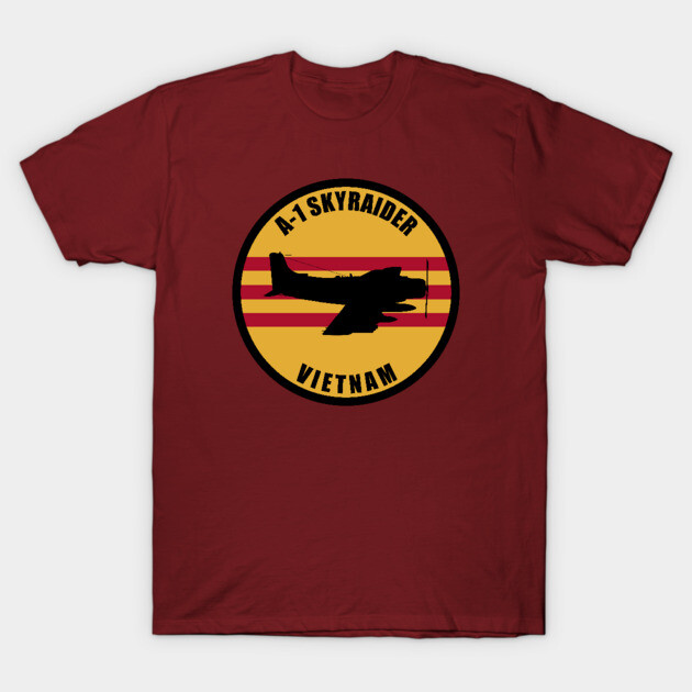 Burgundy t-shirt with A-1 Skyraider Vietnam graphic, round emblem design, casual wear, cotton material.
