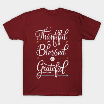 Maroon t-shirt with "Thankful Blessed Grateful" text design, casual wear, cotton material, inspirational message.