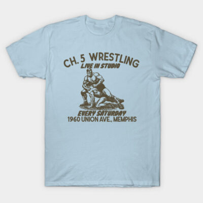 Light blue vintage wrestling t-shirt, featuring retro graphic and text, casual unisex style, cotton material.