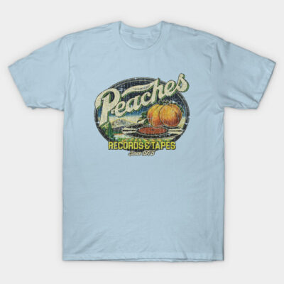 Light blue vintage graphic tee with "Peaches Records & Tapes" design, casual wear, soft cotton material.