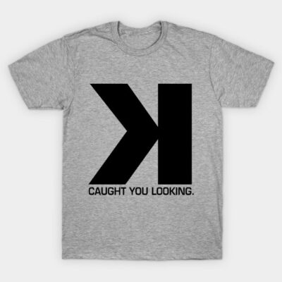 Gray cotton t-shirt with bold black "K" design and "Caught You Looking" text, casual style for everyday wear.