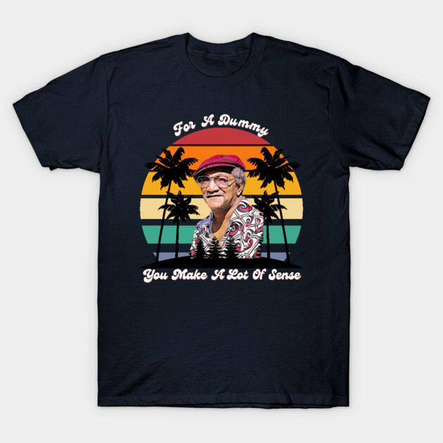 Navy blue t-shirt with sunset and palm tree graphic, featuring text "For A Dummy, You Make A Lot Of Sense," casual style.