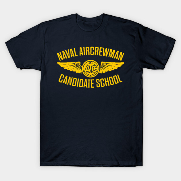 Navy blue t-shirt with "Naval Aircrewman Candidate School" in yellow text, featuring winged emblem, cotton material.