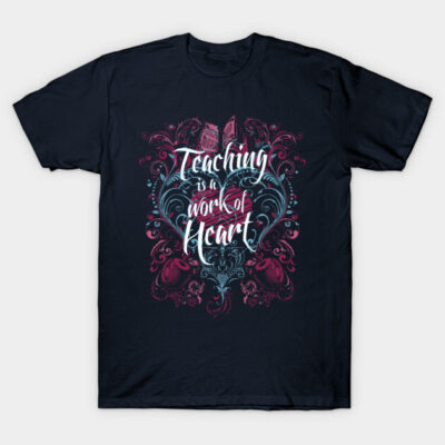 Navy blue T-shirt with "Teaching is a Work of Heart" design in white and pink, featuring decorative swirls.