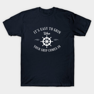 Navy blue t-shirt with nautical theme, featuring ship wheel graphic and "It's Easy to Grin When Your Ship Comes In" text.