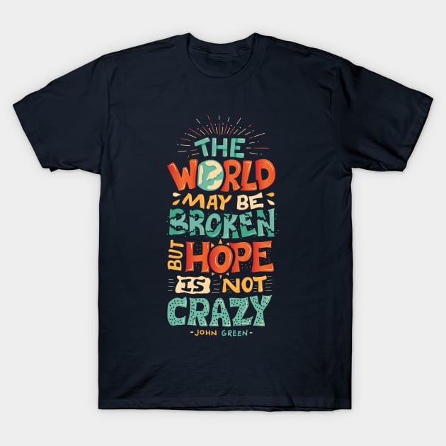 Navy blue t-shirt with colorful inspirational quote design, casual style, 100% cotton, perfect for everyday wear.