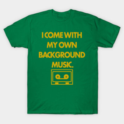 Green t-shirt with yellow text "I Come with My Own Background Music" and cassette graphic, casual wear cotton tee.