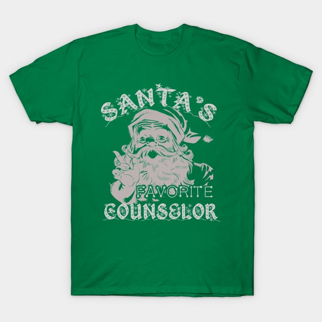 Green t-shirt with "Santa's Favorite Counselor" text and festive Santa graphic, perfect for holiday wear.