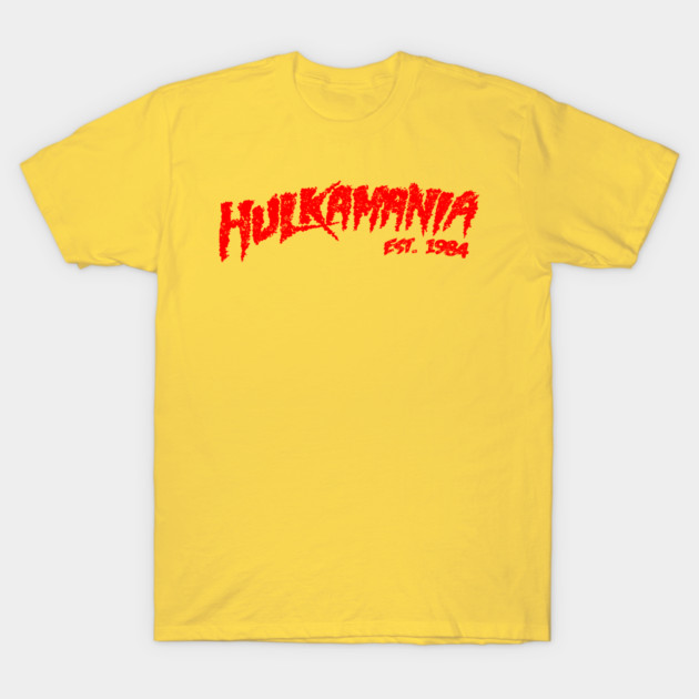 Yellow cotton t-shirt with red "Hulkamania" graphic text, casual style, ideal for everyday wear.