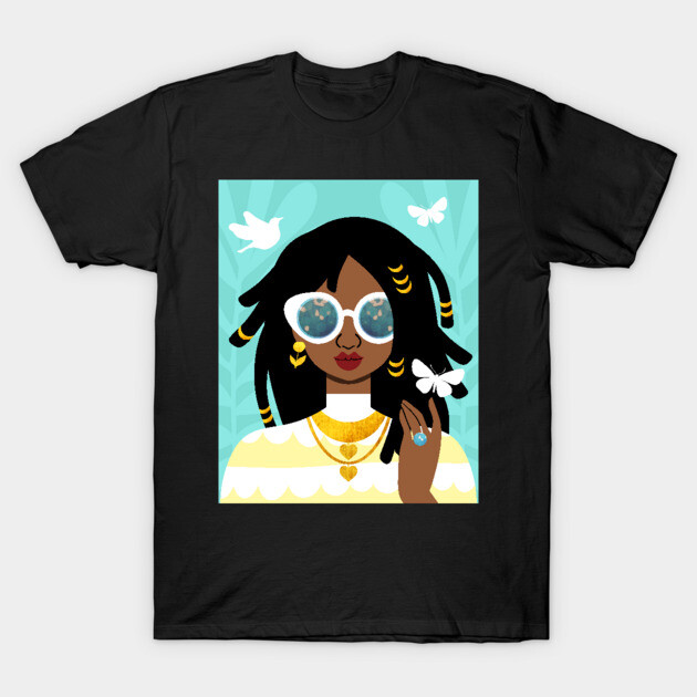 Black graphic t-shirt featuring colorful illustrated portrait with sunglasses and jewelry. Casual style cotton tee.