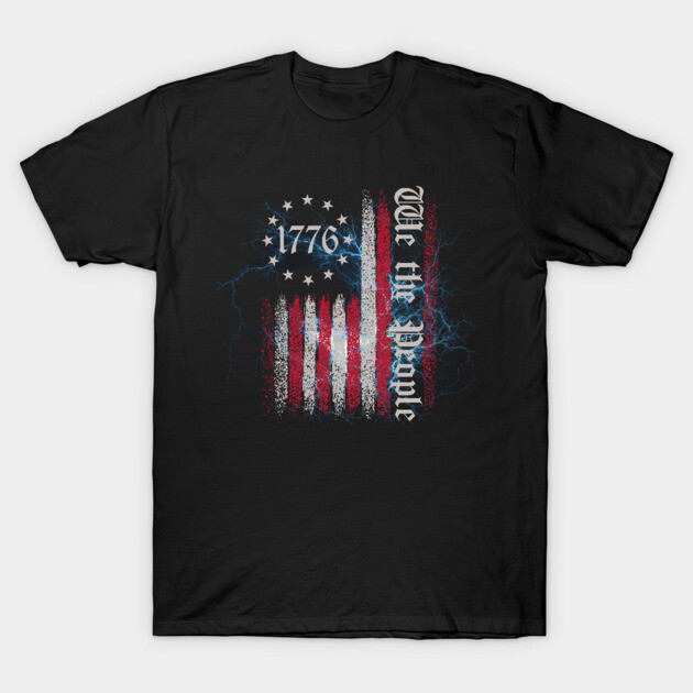Black t-shirt featuring distressed American flag design with "1776" and "We the People" text, patriotic style.