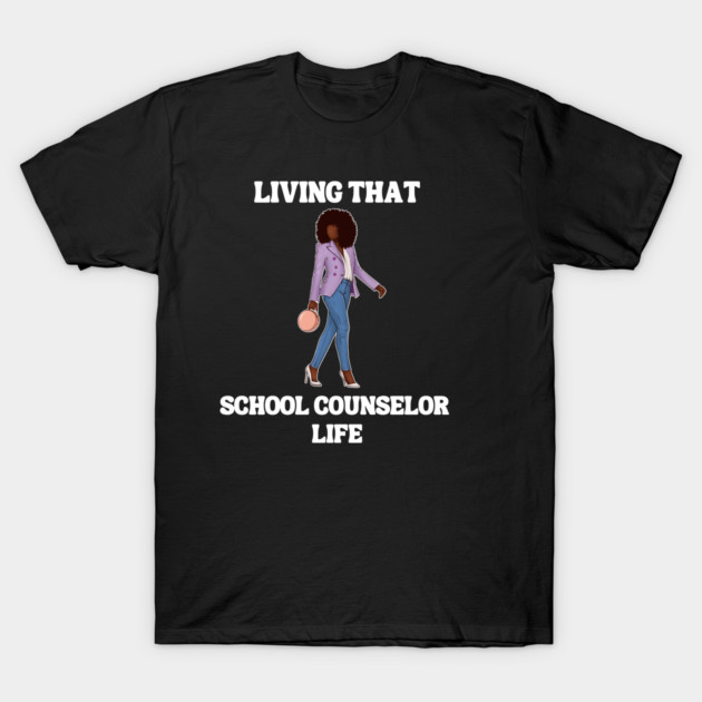 Black t-shirt with "Living That School Counselor Life" text and stylish graphic, casual wear, cotton material.
