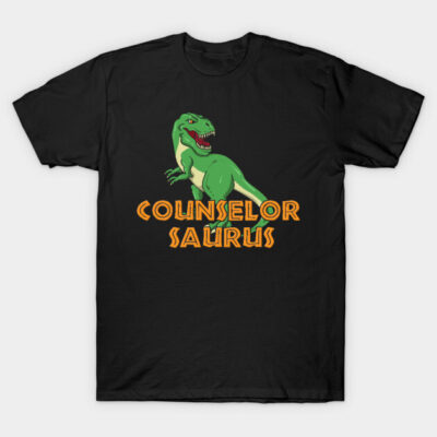 Black "Counselor Saurus" T-shirt featuring green dinosaur graphic, casual style, cotton material, unisex design.