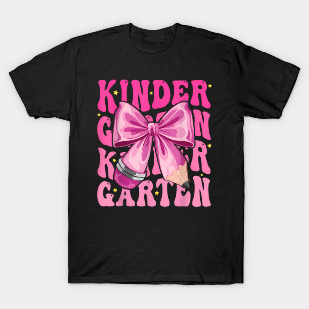 Black t-shirt with pink "Kindergarten" text, featuring a large pink bow and pencil design. Fun school style.