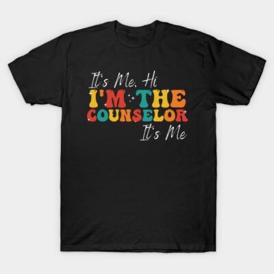 Black t-shirt with colorful text design, "It's Me, Hi," perfect for counselors. Casual style, cotton material.