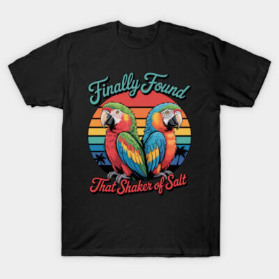 Black t-shirt with colorful parrot design and retro sunset background, featuring playful text. Casual and vibrant style.