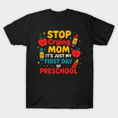 Black t-shirt with colorful "Stop Crying Mom, First Day of Preschool" design, featuring playful crayon and apple graphics.