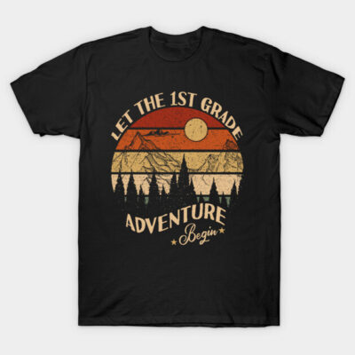 Black t-shirt with "Let the 1st Grade Adventure Begin" design featuring mountains and sunset, perfect for school events.