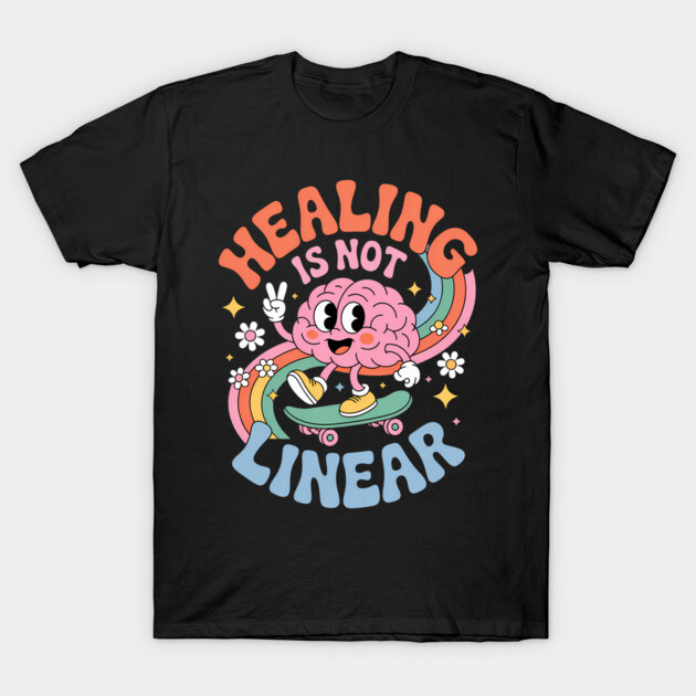 Black t-shirt with colorful "Healing Is Not Linear" design featuring a cartoon brain on a skateboard, casual wear.