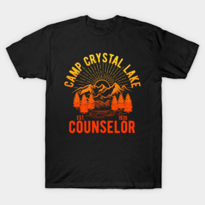 Black "Camp Crystal Lake Counselor" T-shirt with orange mountain and tree graphic, casual style, cotton fabric.