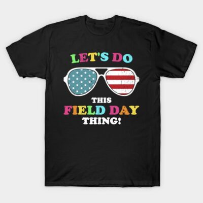 Black T-shirt with colorful text and American flag sunglasses design, perfect for field day events.